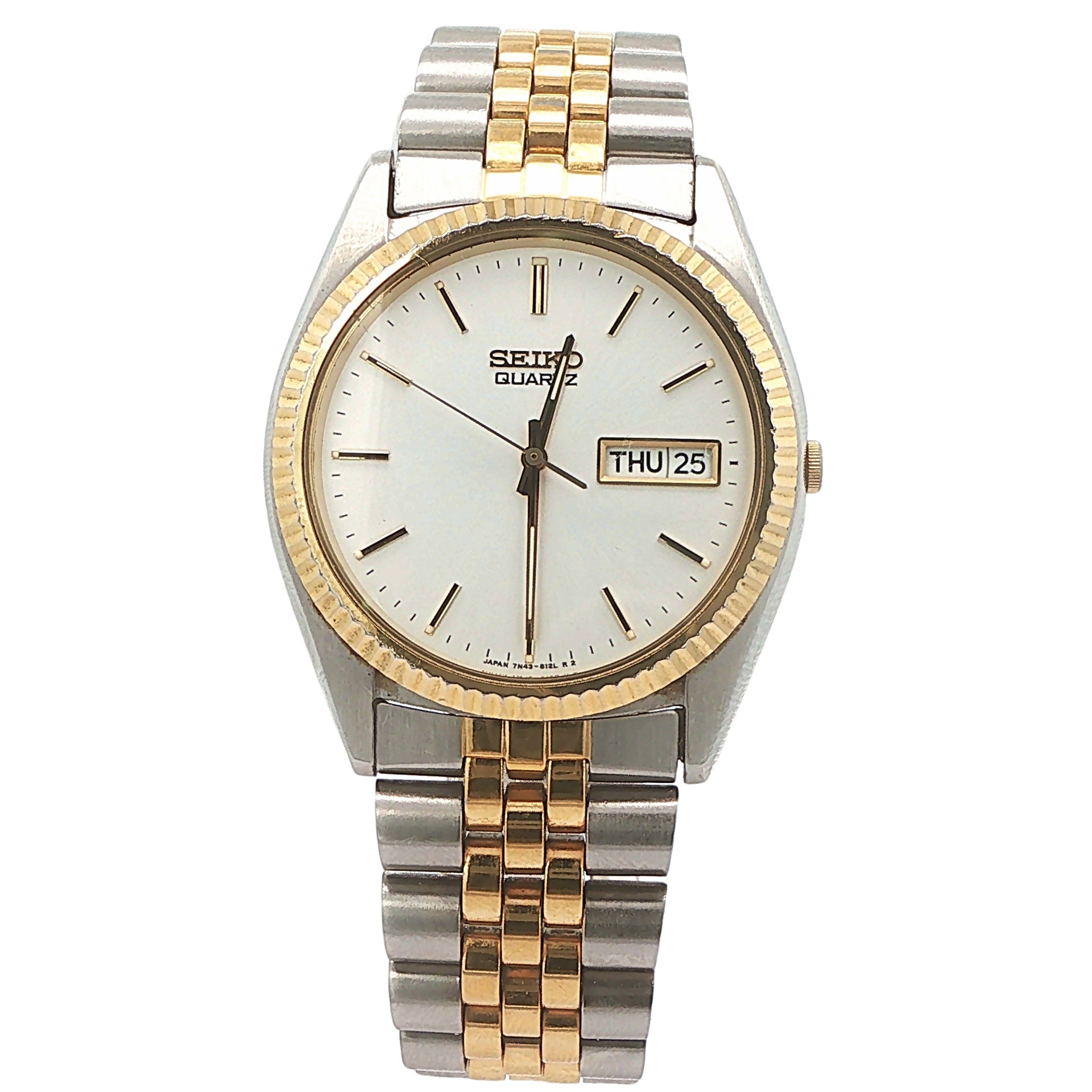 seiko dress watch Vintage Steel Rectangular Gold Dial Watch (1989) Seikos Caliber 4N30 quartz movement ensures accuracy within 15 seconds per month Estate Seiko Quartz Day-Date Two-Tone