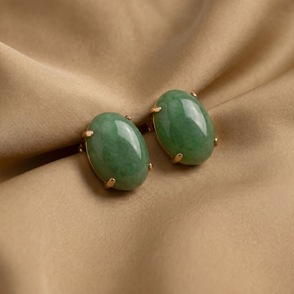 Circa 1950s–1960s Vintage Estate Natural Jade 14K Yellow Gold Clip-On Earrings with Oval Cabochons