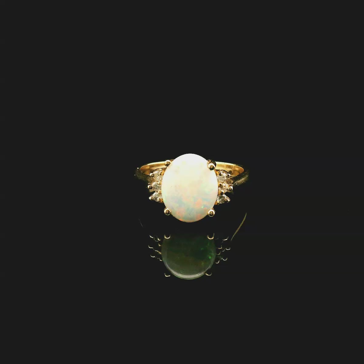 Oval Opal and 6 Diamond Ring